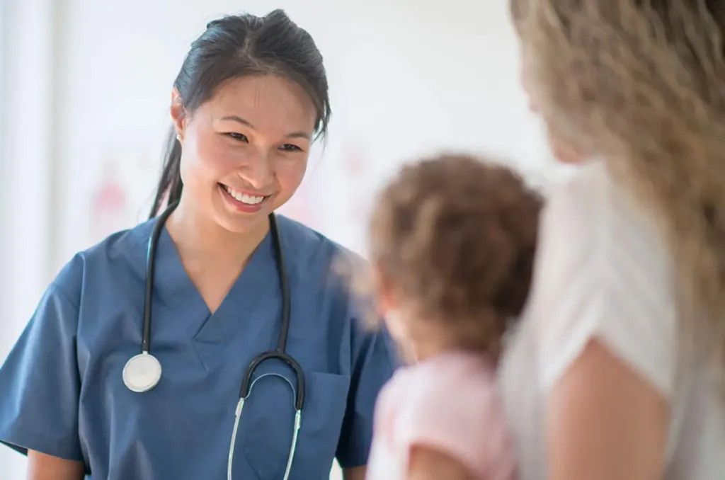 GP consulting with parent and child providing mental health support